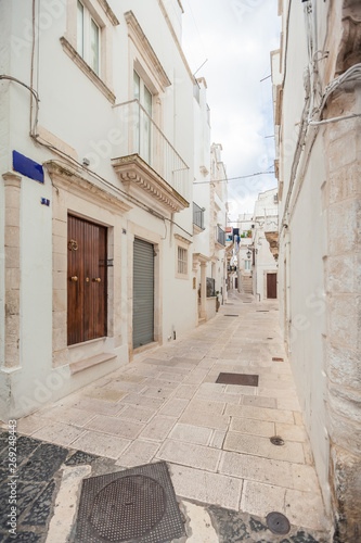 View of the old town of Martina Franca with a beautiful houses painted in white. © nazarovsergey