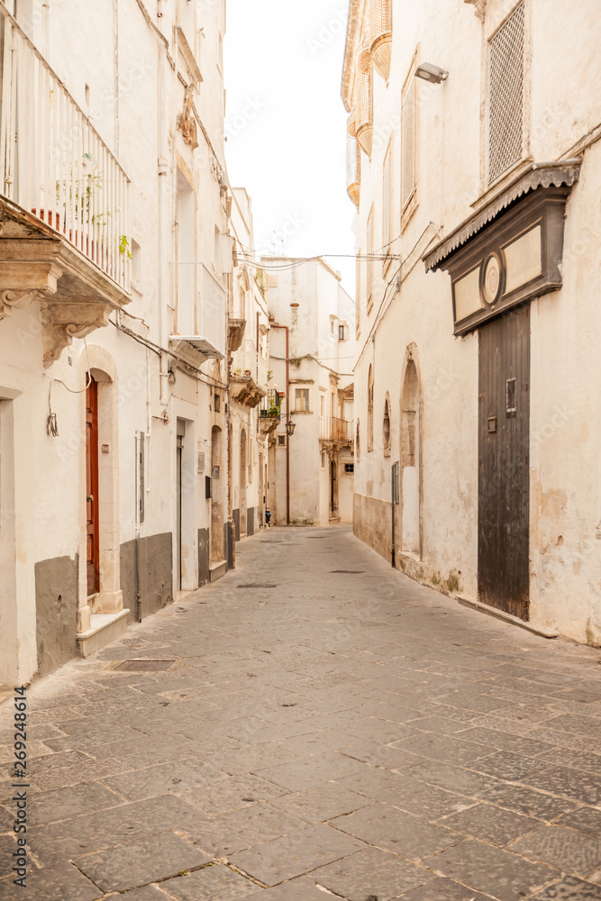 View of the old town of Martina Franca with a beautiful houses painted in white.