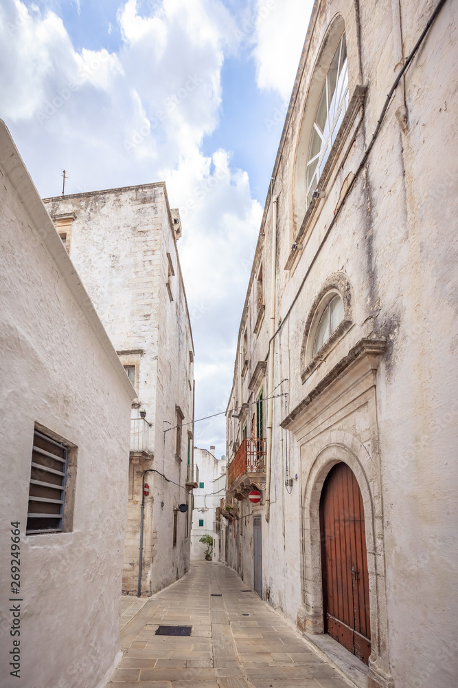 View of the old town of Martina Franca with a beautiful houses painted in white.