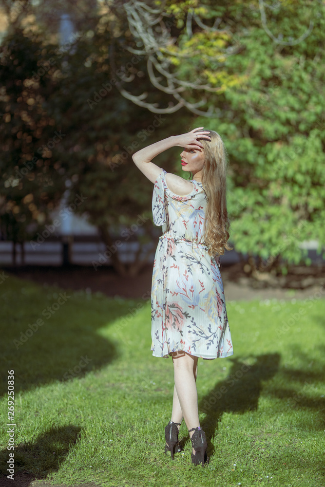 Twin Russian Girl walking in Day on a Luxury Park Twin Russian Girl walking in Day on a Luxury Park