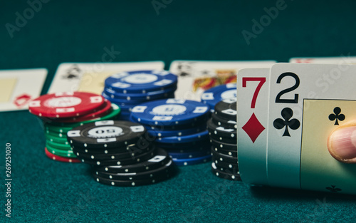 Принти на полотні Bad poker gamble or unlucky hand concept with player going all in with 2 and 7 (