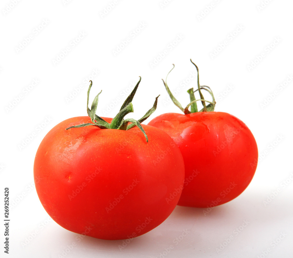 Close-Up Of Red Tomato On White Background Close-Up Of Red Tomato On White Background