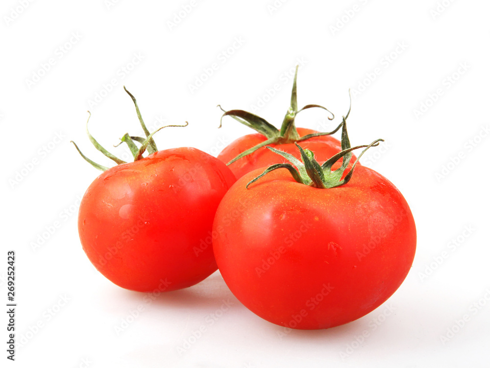 Close-Up Of Red Tomato On White Background Close-Up Of Red Tomato On White Background