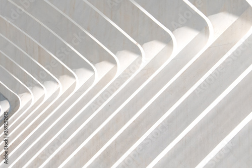 Striking diagonal lines and contrasting whites in a close up of architecture.Background.