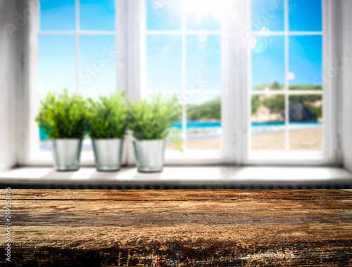 White wooden summer window and brown dirty worn desk space 