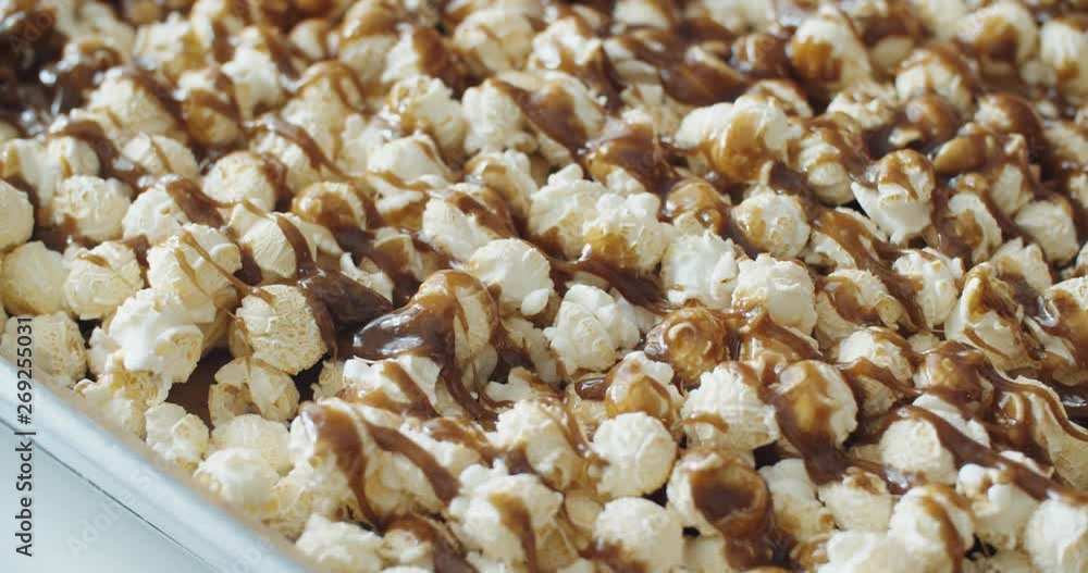 Close up pouring caramel melts down on mushroom popcorn, Slow Motion, 4K Close up pouring caramel melts down on mushroom popcorn, Slow Motion, 4K
