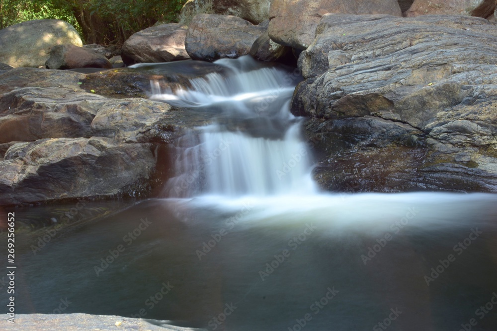 Kumbakkarai Water Falls and the Pambar river flows along the rocks Kumbakkarai Water Falls and the Pambar river flows along the rocks