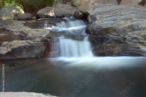 Kumbakkarai Water Falls and the Pambar river flows along the rocks