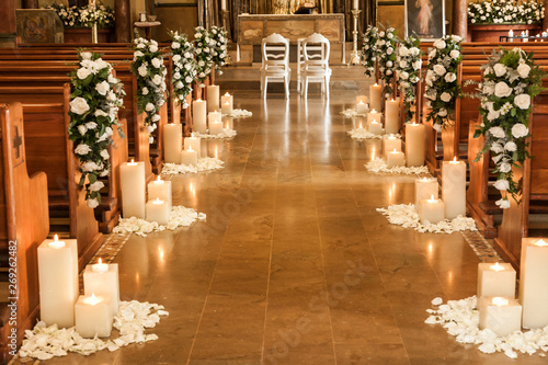 Catholic temple decorated with flowers and candles for wedding