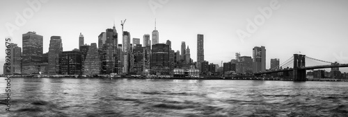 Black and white panoramic view of New York City silhouette at sunset, USA.