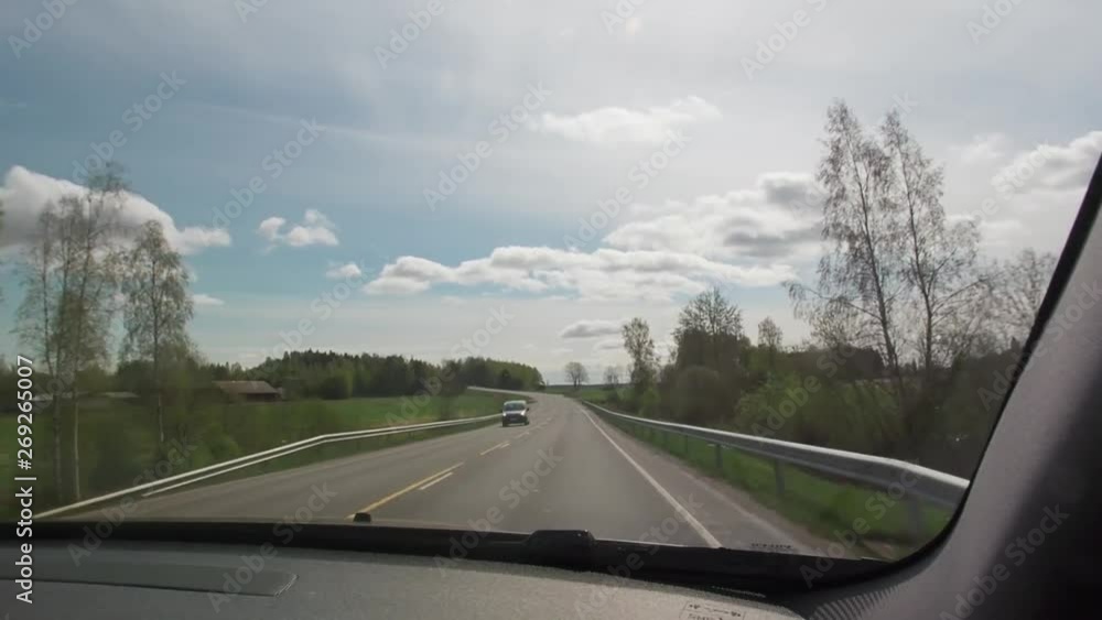 Driving Car on a Sunny Day. Man drives car on the road in sunny day. Driving Car on a Sunny Day. Man drives car on the road in sunny day.