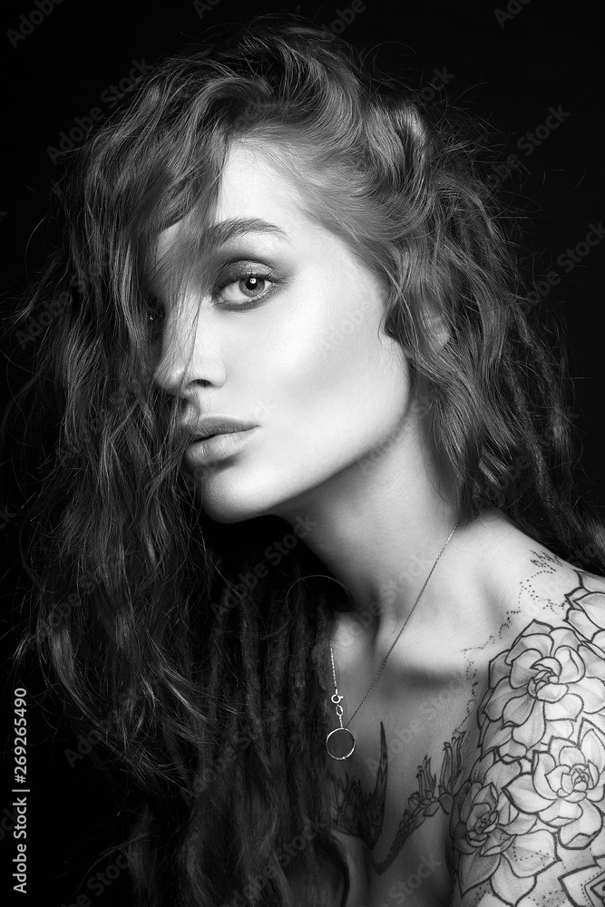 Black and white Portrait of Beautiful Girl with tattoo