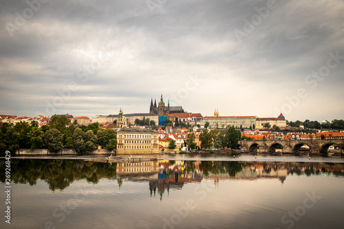 Beautiful Vltava river in Prague with old town and historical buildings in the background
