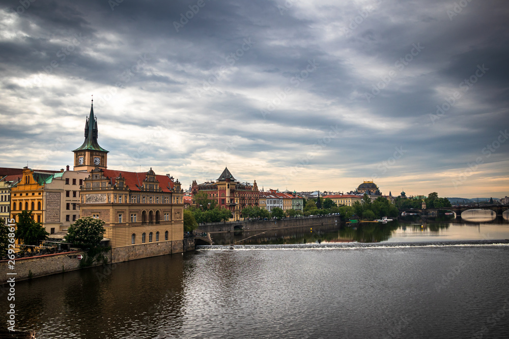 Naklejka premium Beautiful Vltava river in Prague with old town and historical buildings in the background