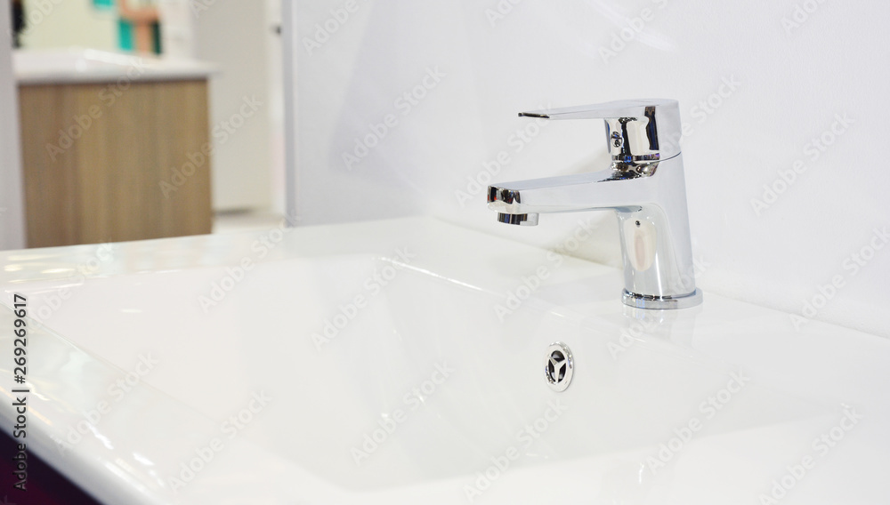 Fototapeta premium Modern bathroom sink, water tap and chrome faucet for bath basin