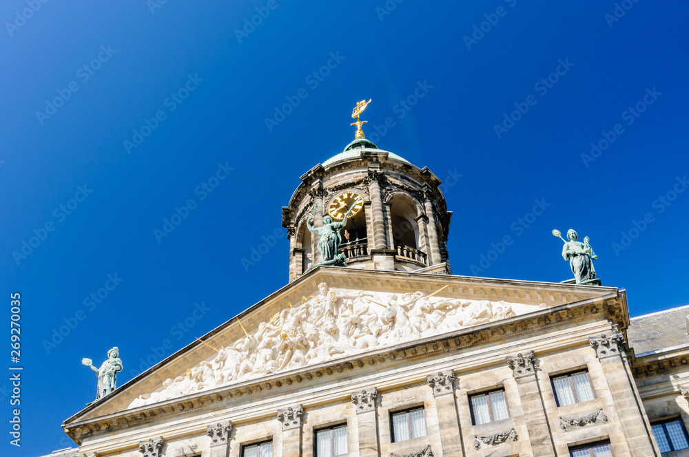 Clock on the top of the Royal Palace in Dam Square, Amsterdam