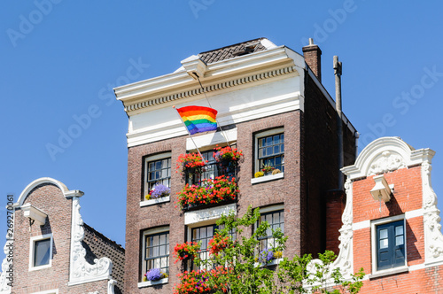 Photography A canal house flies a rainbow flag for Gay Pride