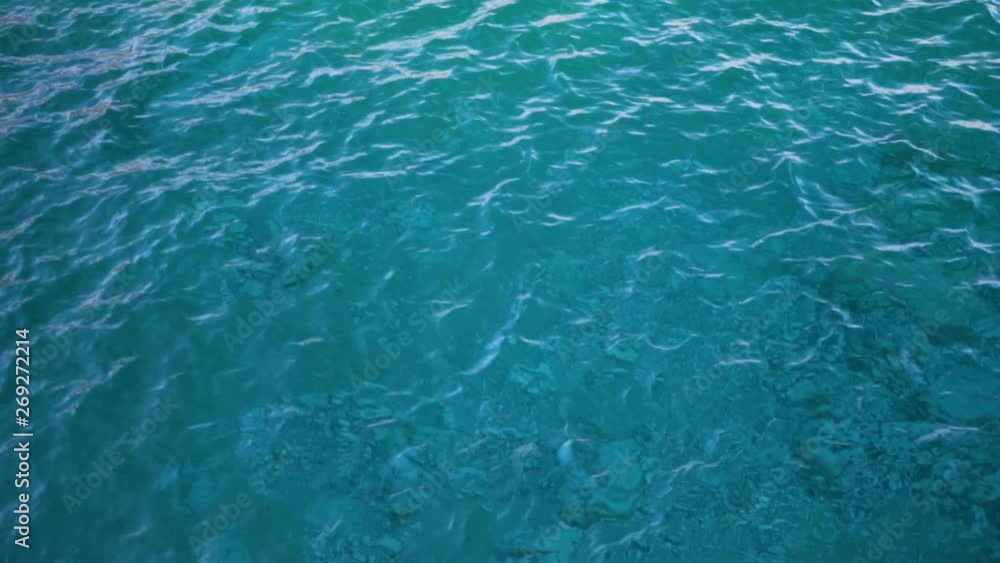 Close up of disturbed blue ocean water surface. Slow motion Close up of disturbed blue ocean water surface. Slow motion