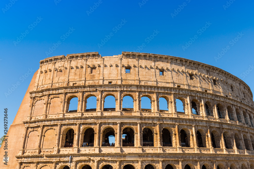 The Colosseum in Rome with blue sky, Italy 