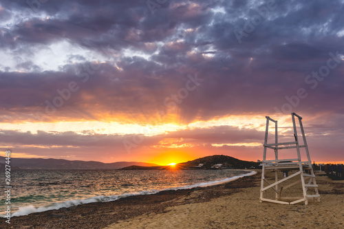 Sunset behind the Cyclades at Agios Prokopios beach, Naxos, Greece photo