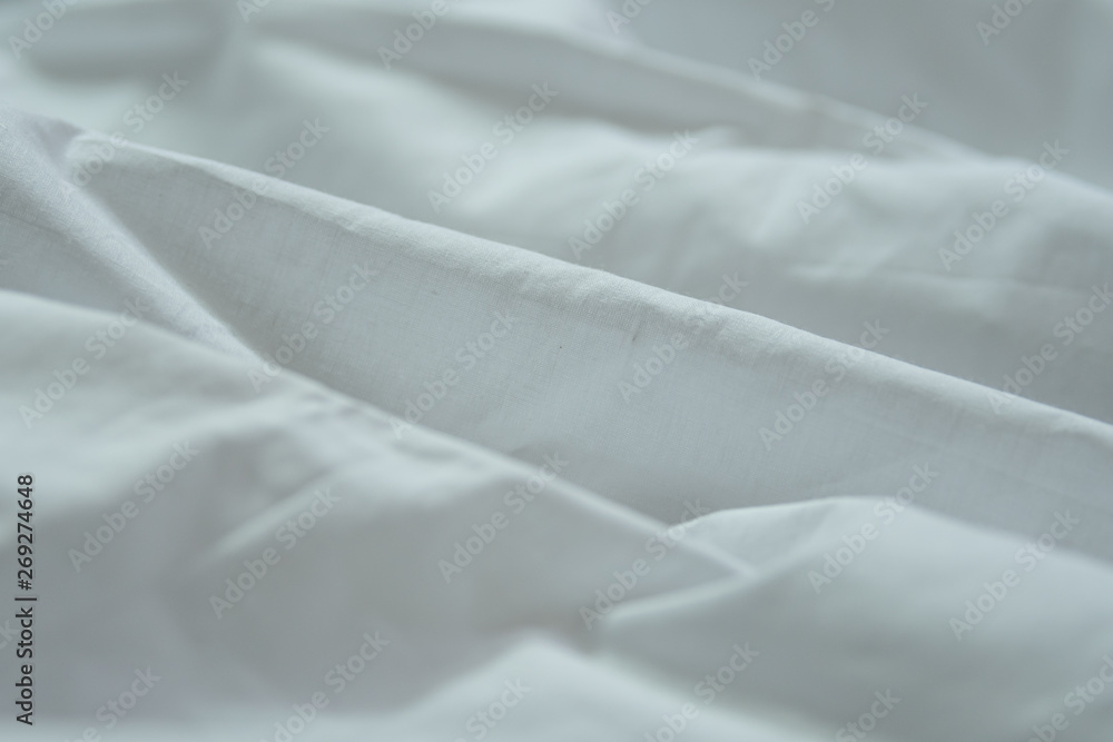 A simple isolated white cloth background with natural curves in a white cloth A simple isolated white cloth background with natural curves in a white cloth