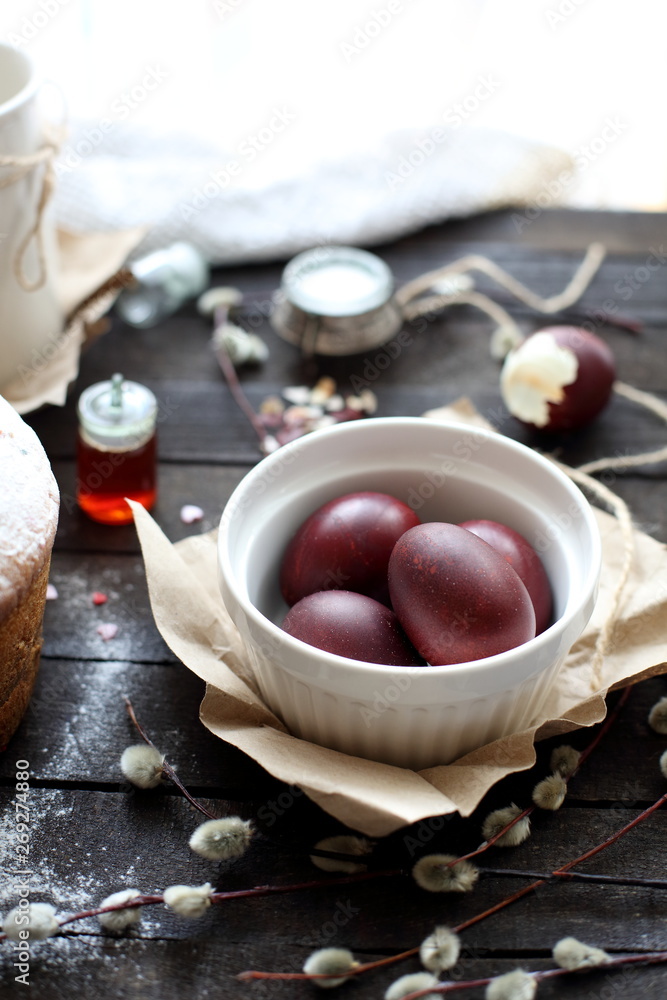 Easter still life with cake on a dark wooden background