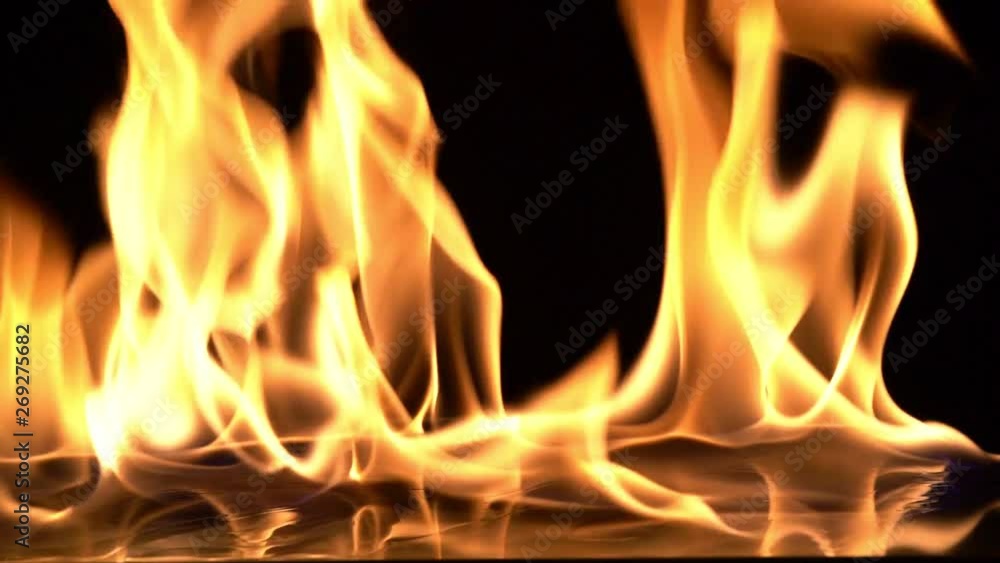 Slow Motion video shooting,Fire Flames Igniting And Burning.Real fire , A line of real flames ignite on a black background. Slow Motion video shooting,Fire Flames Igniting And Burning.Real fire , A line of real flames ignite on a black background.