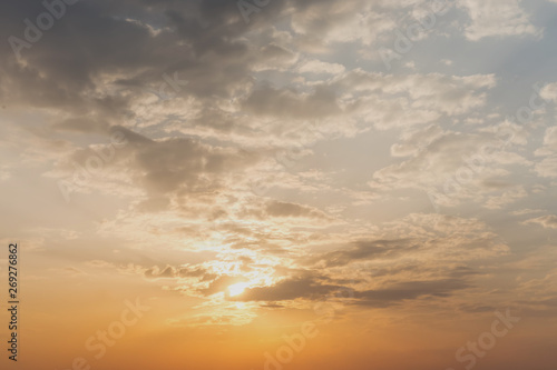 sunlight from sunset illuminates the cloudy sky © Bonsales