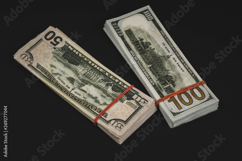 american Dollars banknotes isolated on black background.