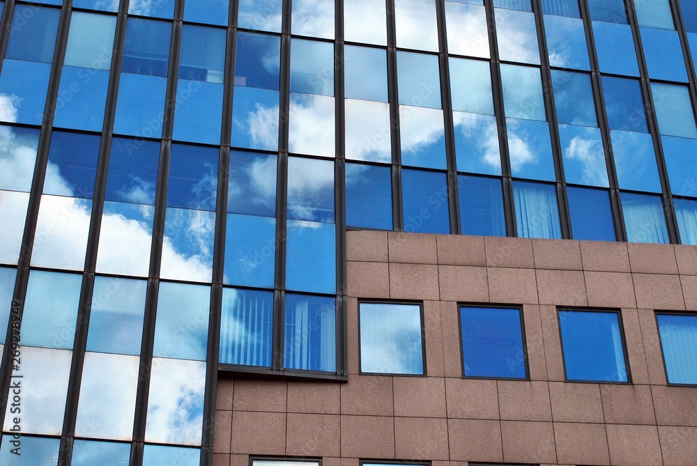 modern office building with blue sky and clouds modern office building with blue sky and clouds