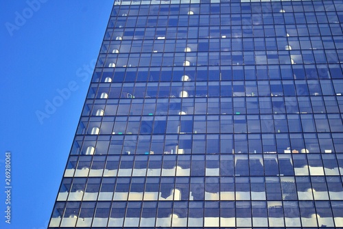 modern building with reflection in windows of building