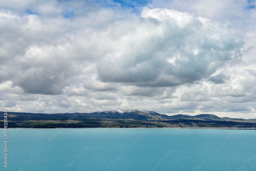 Lake Pukaki under cloudscape in Pukaki, New Zealand Lake Pukaki under cloudscape in Pukaki, New Zealand
