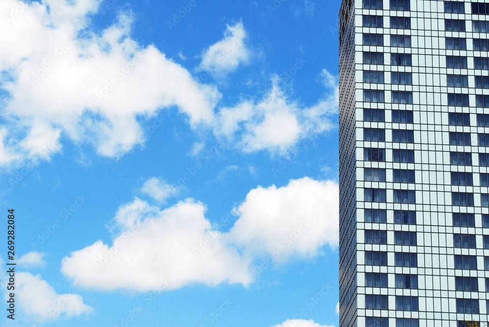 modern building with blue sky and clouds