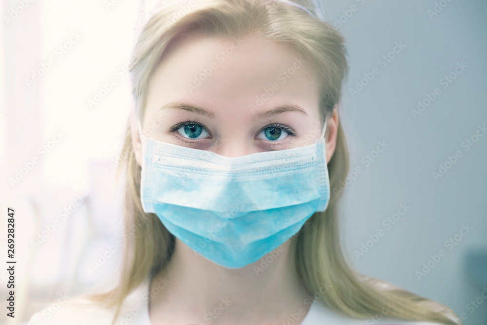 Portrait of young woman wearing surgical mask Portrait of young woman wearing surgical mask