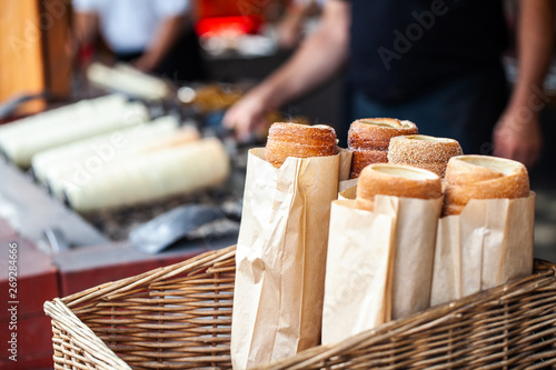 Hungarian Twist Roll. Hungarian Kurtoskalacs prepared on the grill, at a traditional street food market photo