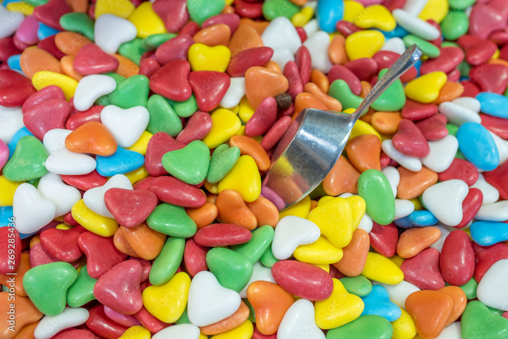 Top view of colorful candies with spoon Top view of colorful candies with spoon