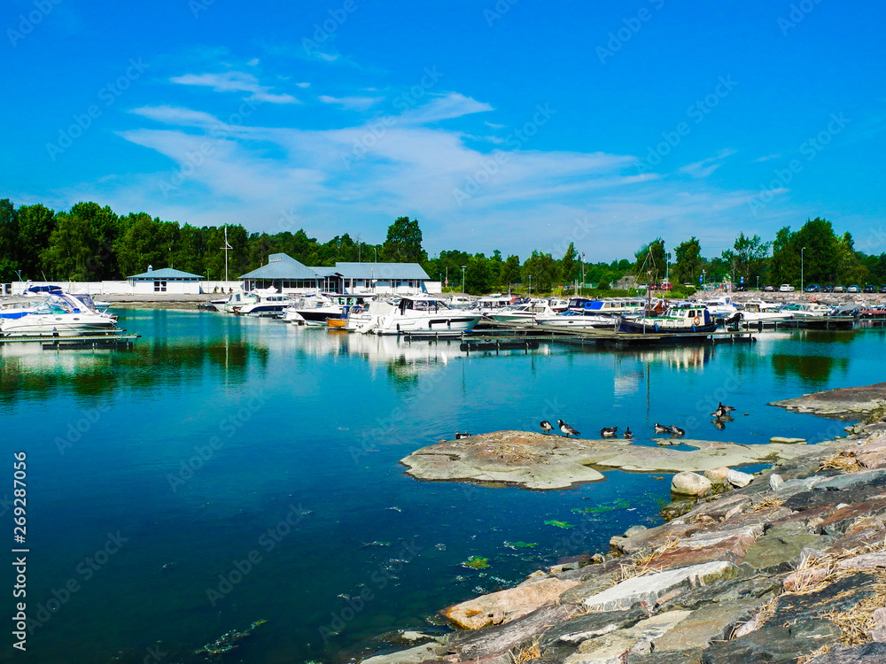 Helsinki, Finland. A lot of boats and yachts, beautiful lake panorama. Bright summer day with blue sky.         