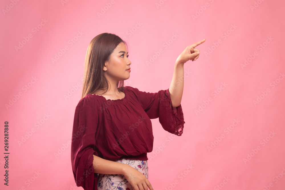 Asian woman touching the screen with finger. Asian woman touching the screen with finger.