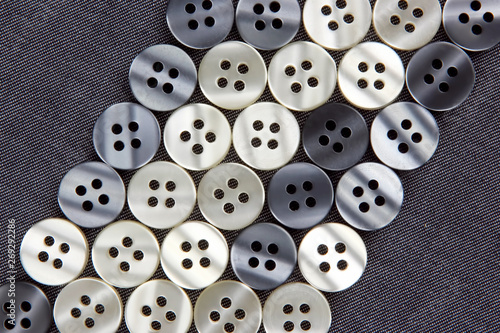 different mother of pearl buttons on fabric