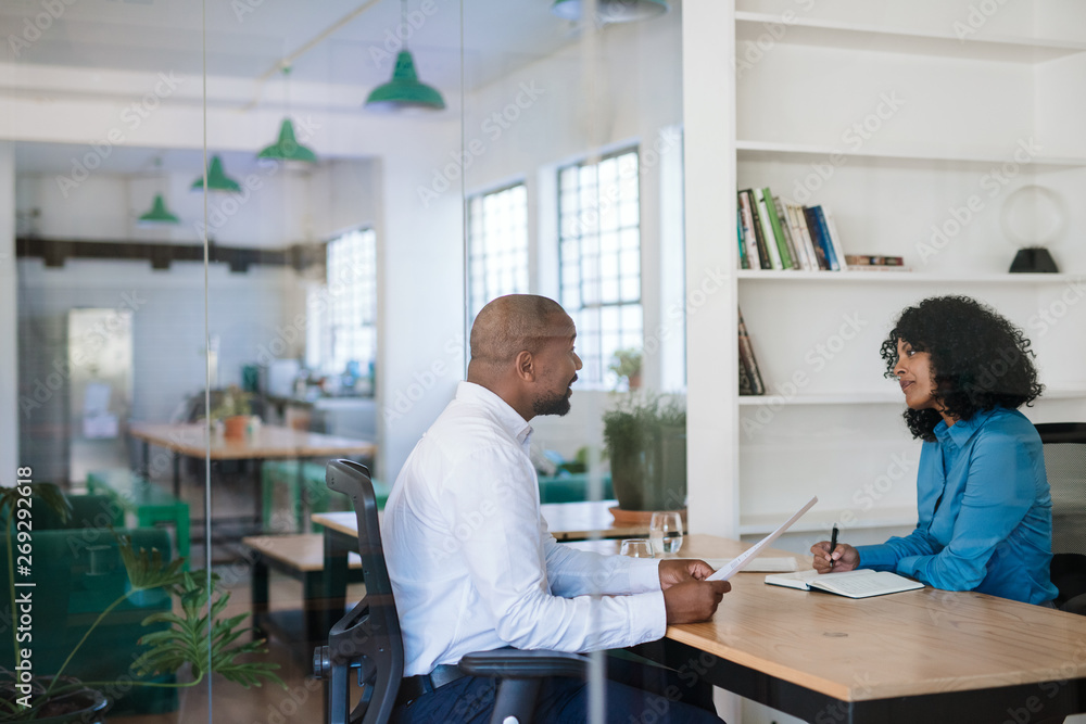 Manager interviewing a potential new employee in her office Manager interviewing a potential new employee in her office