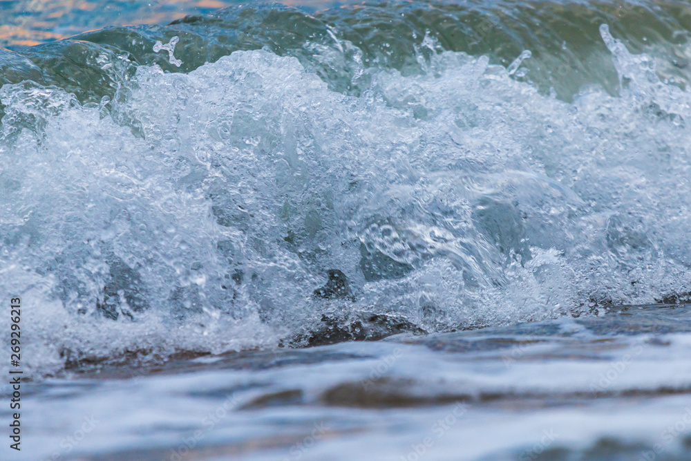 Seashore on stone beach. Close up view.