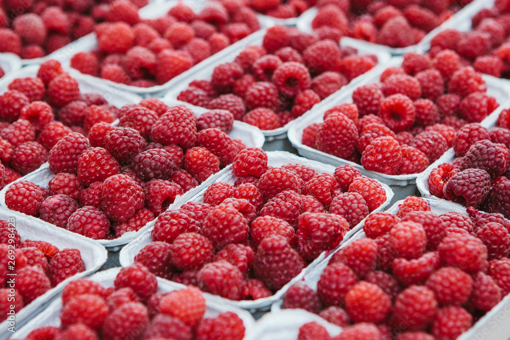 A lot of raspberries in containers. Useful food A lot of raspberries in containers. Useful food