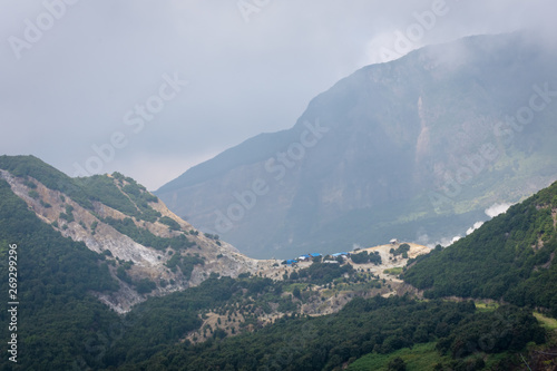 A view of Tebing Soni, Papandayan on the back side with thick vegetaion on it on cloudy grey day. Papandayan Mountain is one of the favorite place to hike on Garut.