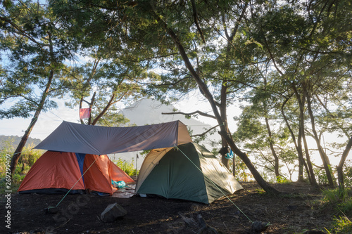 A two tent nicely set up on Ghober Hut campsite, Papandayan. Warm morning to relax and enjoy the nature. Papandayan Mountain is one of the favorite place to hike on Garut. © Ivan