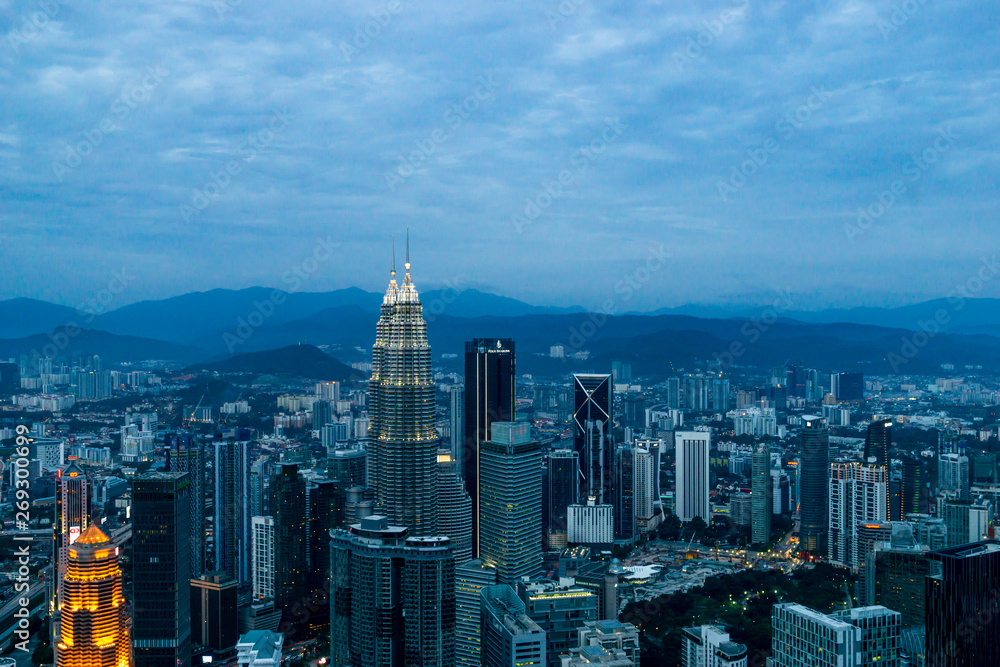 Fototapeta premium View over the cityscape of Kuala Lumpur at dusk from the KL Menara Tower in KL, Malaysia