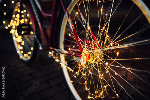 Christmas lights on bike background texture in city