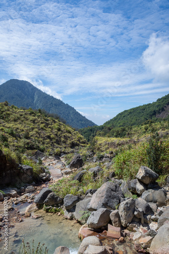 Rocky stream with clear water on a mountain. Beautiful landscape of mount Papandayan. Papandayan Mountain is one of the favorite place to hike on Garut.