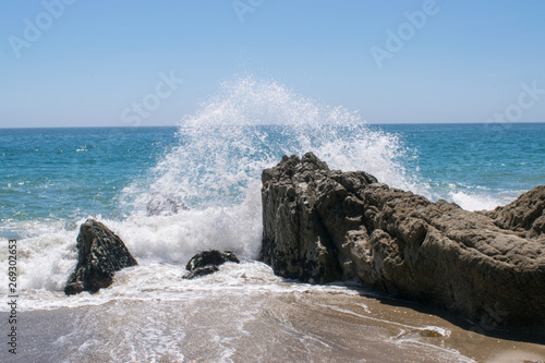 waves crashing on rocks in Sycamore Beach, California