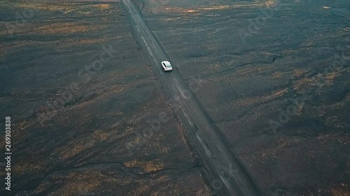 view from the sky of a car travelling through iceland on F208 Road photo