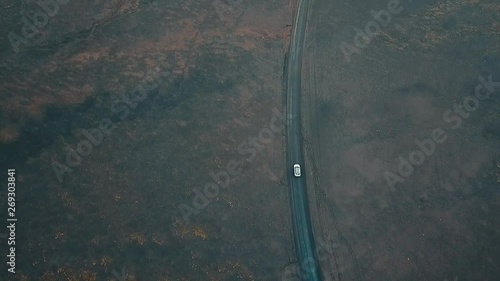 top down view of a white car travelling through iceland on F208 Road photo